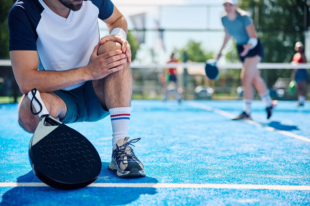 Pickleball player served by racket sport injury specialist Dr. Nicholas Cheng at Rally Point Health and Rehab in Markham ON
