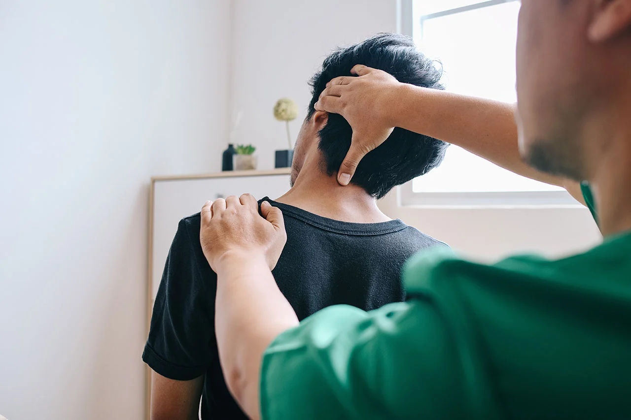 Chiropractor performing a spinal adjustment at Rally Point Health and Rehab serving Unionville Markham ON